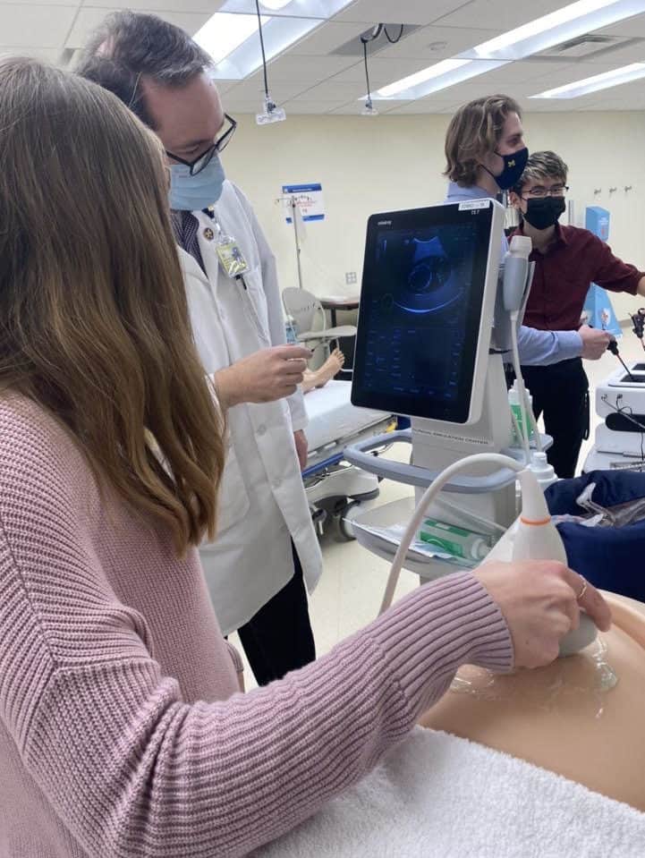 U-M IOE Caroline Hirth conducts an ultrasound on a dummy at Michigan Medicine. 