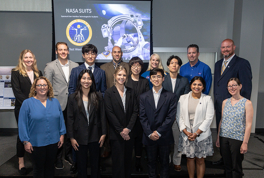 People poses for a photo after a presentation to NASA