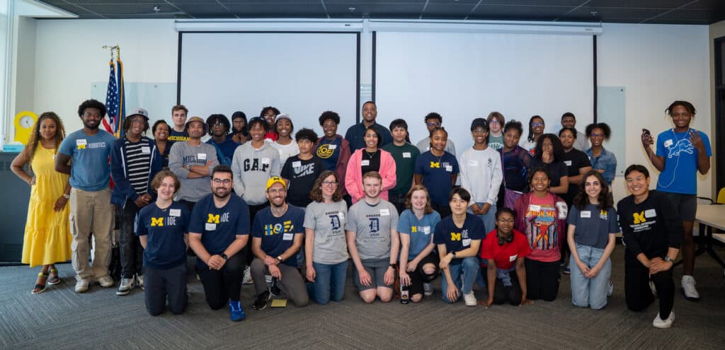 Group photo of 40 people in a classroom.